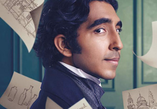 David Copperfield, dressed in period clothing, stands as sketches of people and buildings float around him on paper