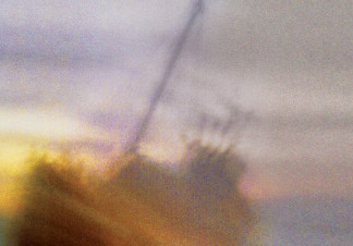 A ship at sea rocks to the side