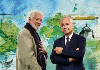 Matthew Kelly as W. H. Auden and David Yelland as Benjamin Britten stand in front of a painted background of a canal and trees