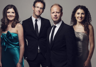 The members of the Carducci quartet stand together in formal wear